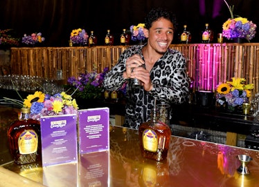 anthony ramos shaking a cocktail