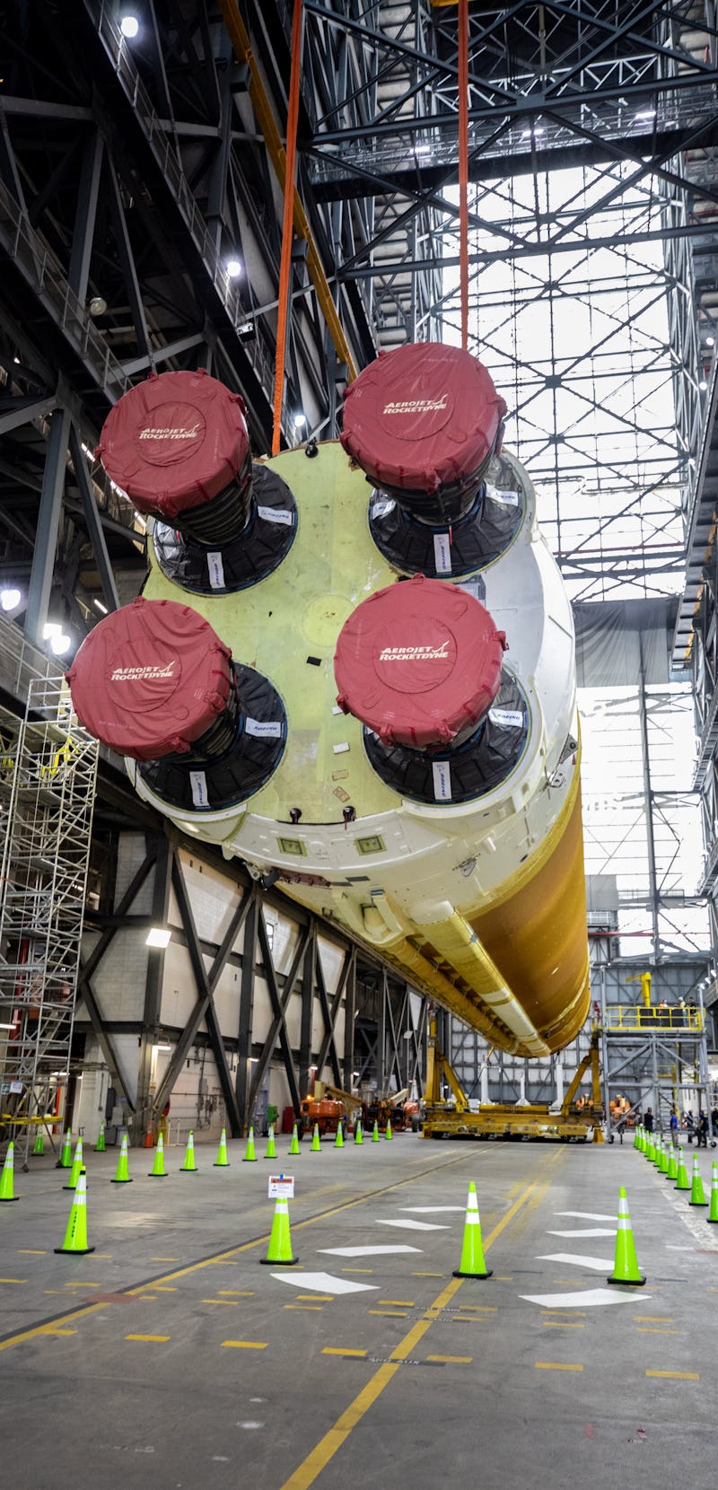 SLS core stage rocket for Artemis 1 being lifted by NASA engineers