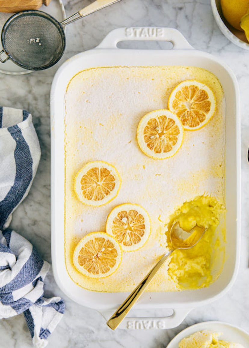 lemon pudding cake topped with sliced fresh lemons