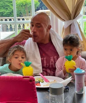Dwayne Johnson has tea time with daughters, Tiana and Jasmine . 