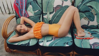 Model wears orange Zara bikini.