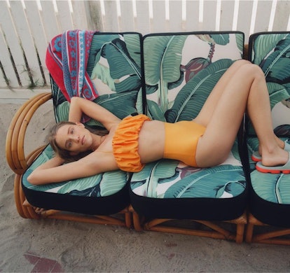 Model wears orange Zara bikini.