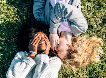 2 best friends laying in the grass, telling secrets on a Saturday before posting a pic on Instagram ...