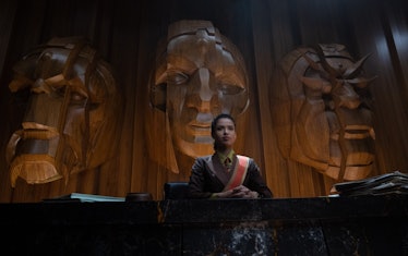 Gugu Mbatha-Raw as Ravonna Renslayer sitting in front of the Time Keeper statues