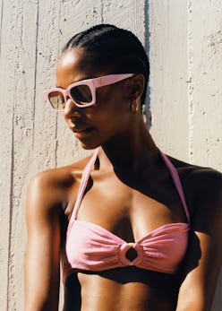 Model wears square sunglasses from Jimmy Choo.