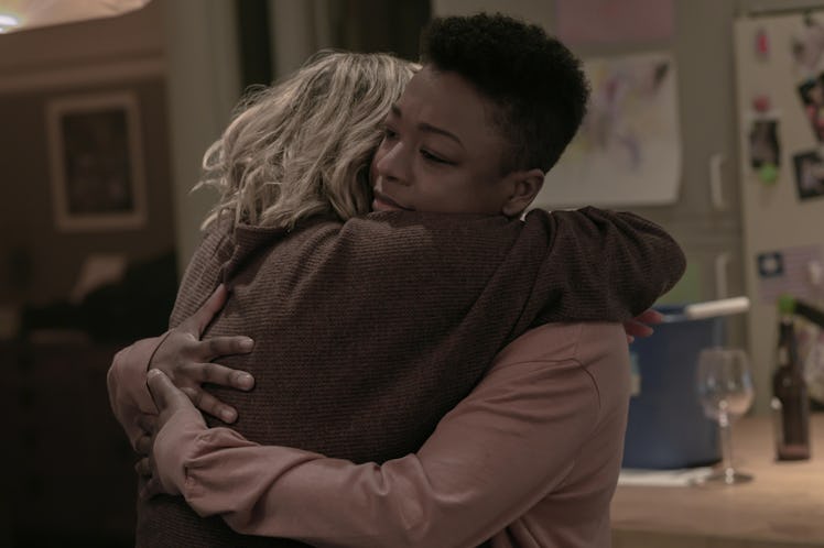 Elisabeth Moss as June and Samira Wiley as Moira embracing at the end of The Handmaid's Tale Season ...