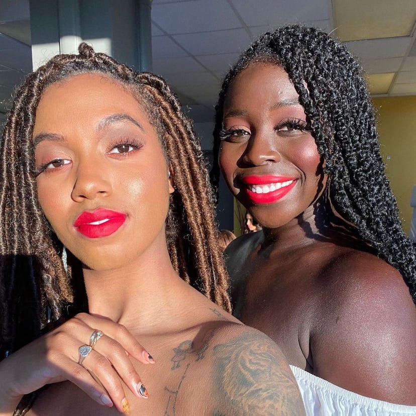 Two women wearing hot pink-red lip from The Lip Bar