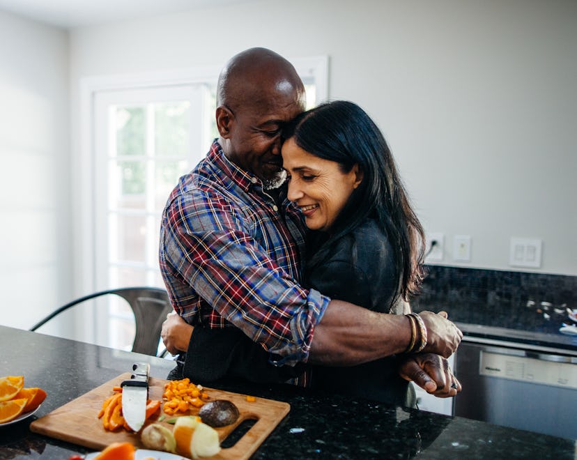 couple cuddling in the kitchen