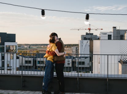 Young woman hugging her partner after getting one of the best gifts for Cancer.