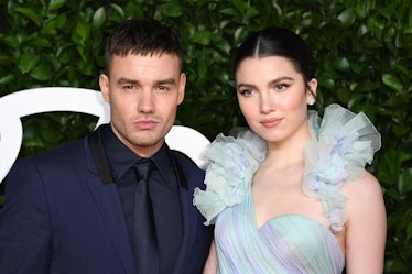 Liam Payne in a navy suit and Maya Henry in a light blue tulle dress