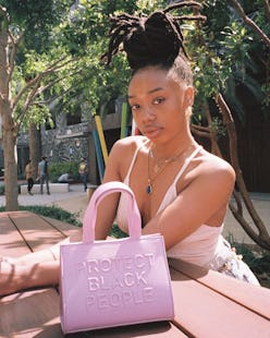 Model carrying a "Protect Black People" CISE bag.