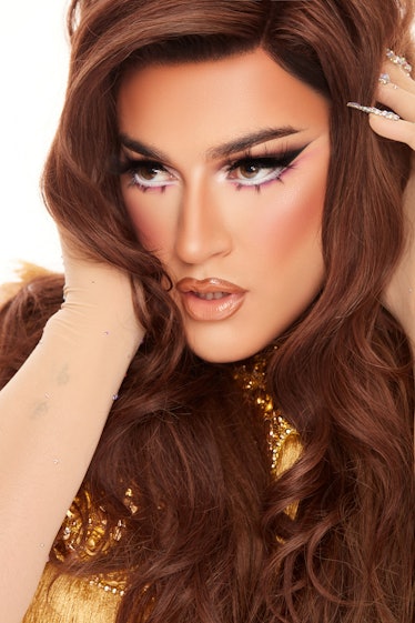 Manny Gutierrez, aka Manny MUA, poses in a gorgeous drag makeup look in promotional images for Lunar...