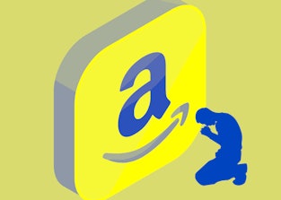 Man kneeling in front of Amazon logo