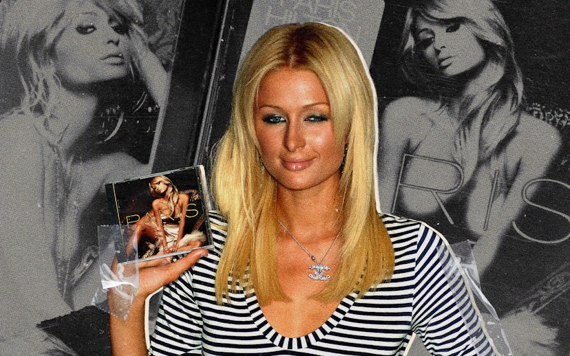 Paris Hilton wearing a gray T-shirt and smiling slightly