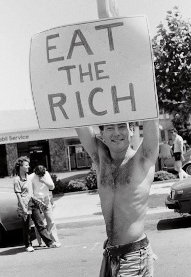 National March for Gay and Lesbian Rights with a poster 'EAT THE RICH' by Catherine Opie