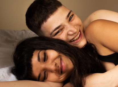 Young couple laying down together as the most sexual zodiac signs.