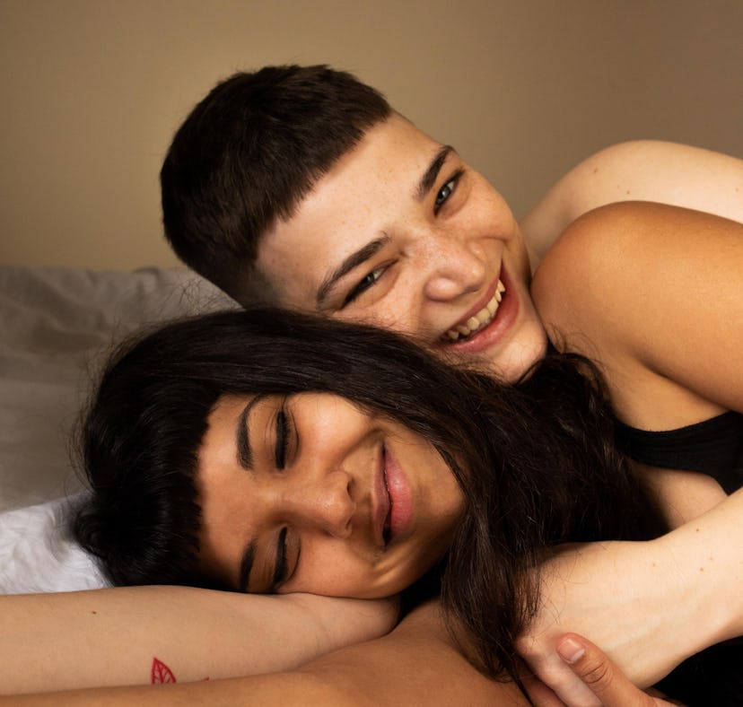Young couple laying down together as the most sexual zodiac signs.