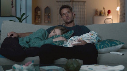 Justin Hartley and Caitlin Thompson as Kevin and Madison asleep in front of the TV