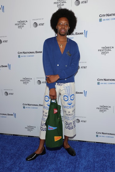 Jeremy O. Harris in a blue blazer and white pants with black loafers 