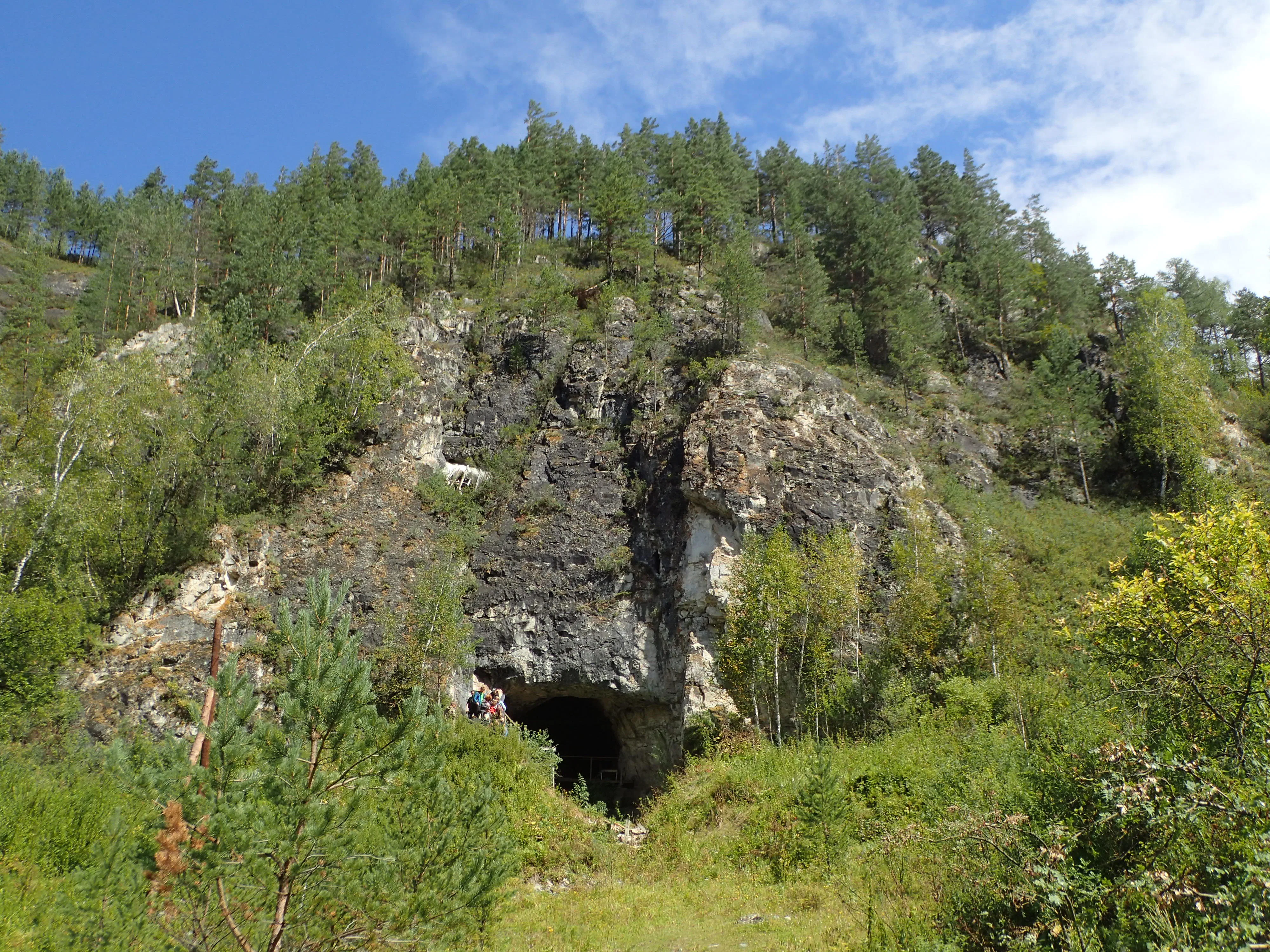 A cave nestled in the Russian mountains could solve an ancient human mystery