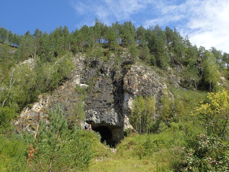 Entrance to Denisova cave in mountains