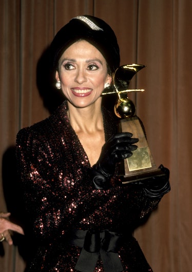 Rita Moreno posing with a trophy at the annual Nostros Awards