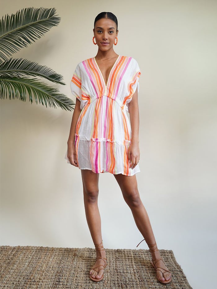 woman wearing pastel striped dress for breastfeeding