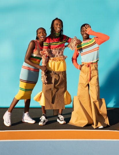 Models wearing stripy colorful knitted items from 'Black Boy Knits'