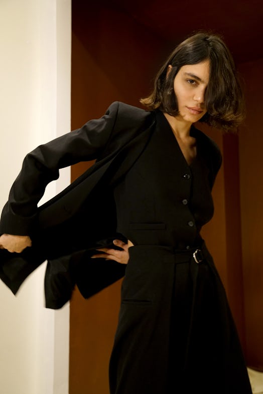 Model wearing an all-black look by KALLMEYER 