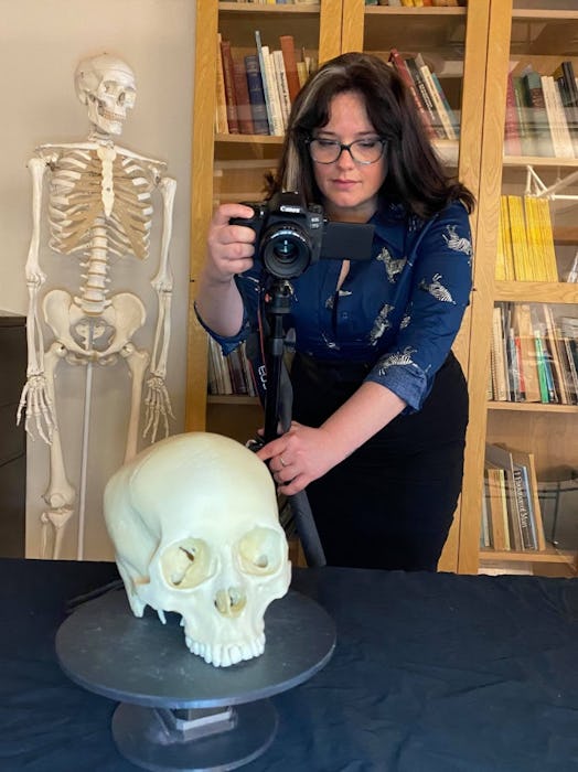 scientists taking photos of a skull for 3d model of anglo-saxons