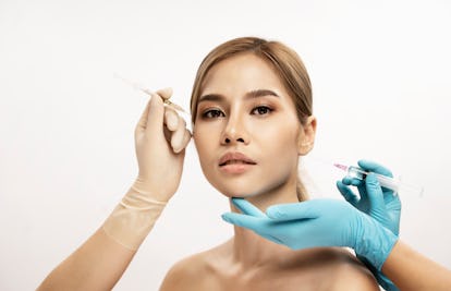 Woman receiving facial injections