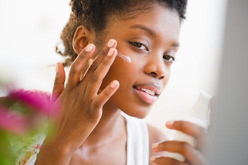 woman applying lotion