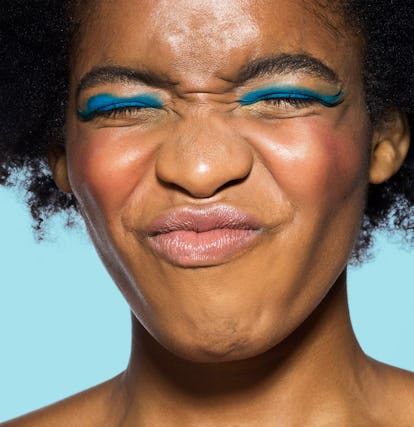 Woman wrinkling her face