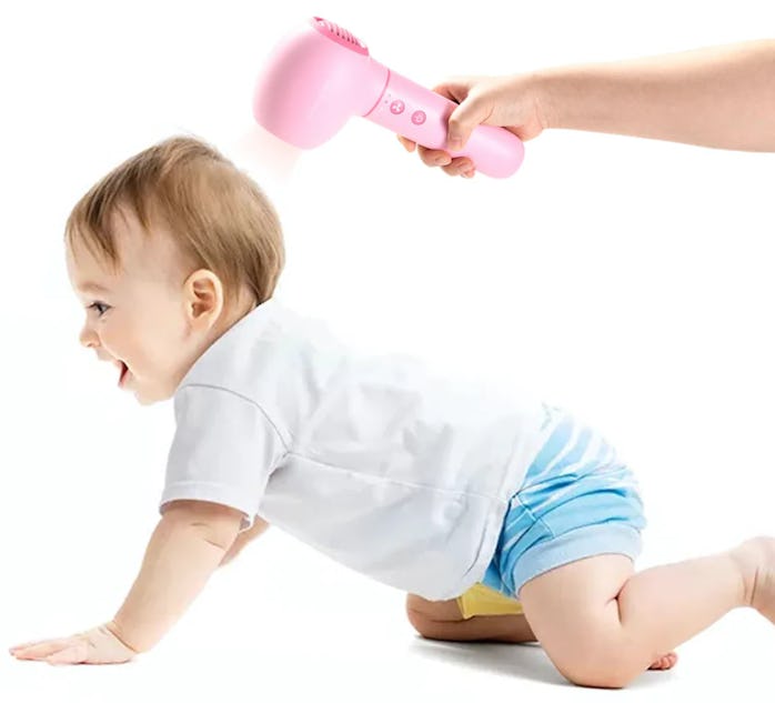 Wireless Baby Dryer in use on baby promo art.