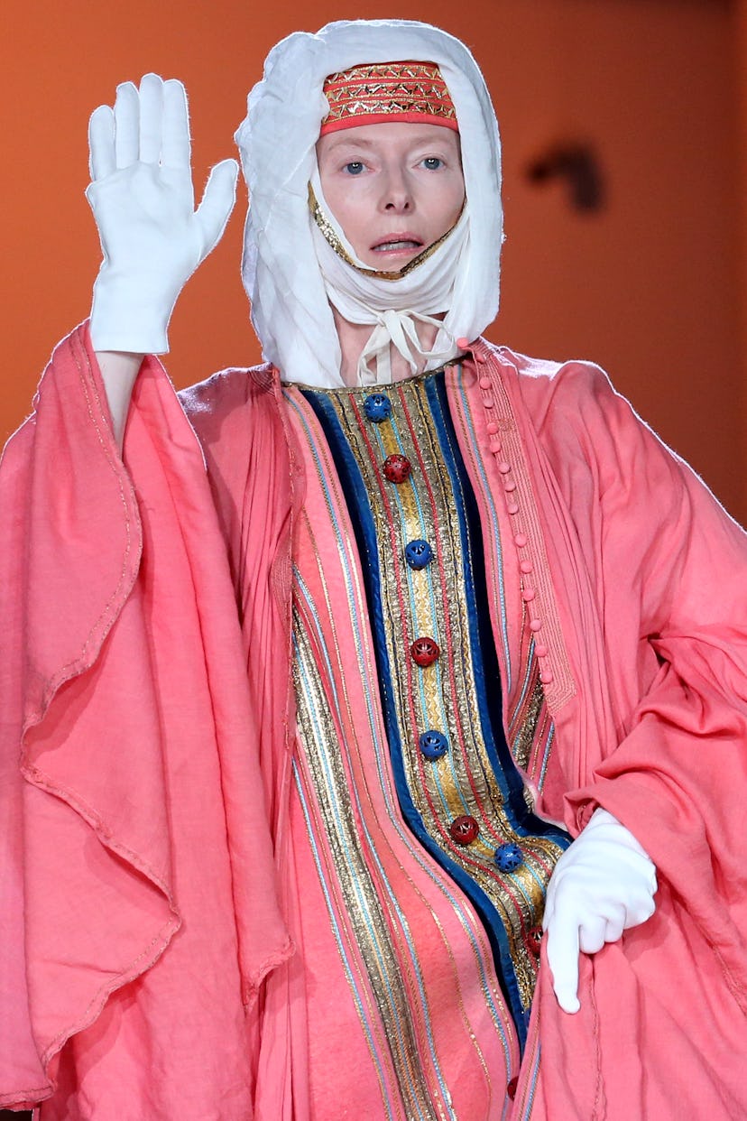 Tilda Swinton, swathed and looking transported