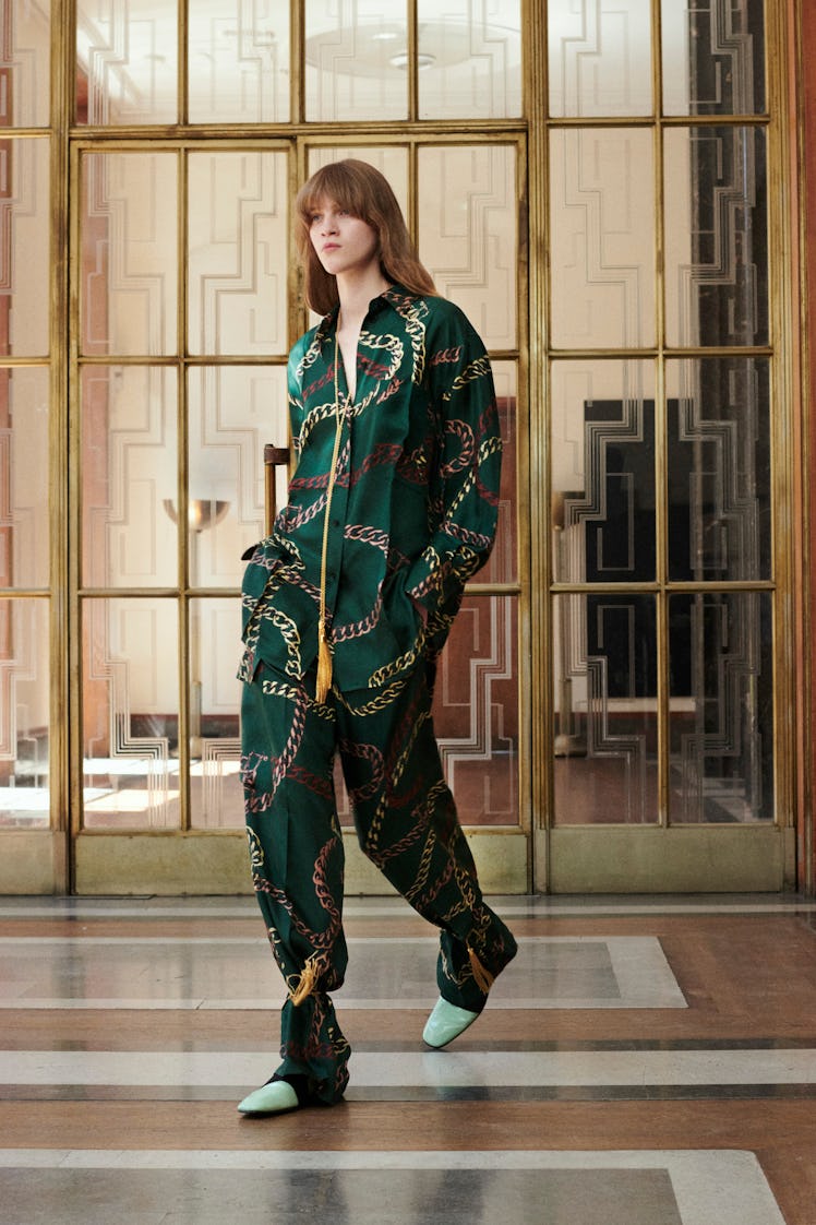 Model walking while wearing a printed pajama set