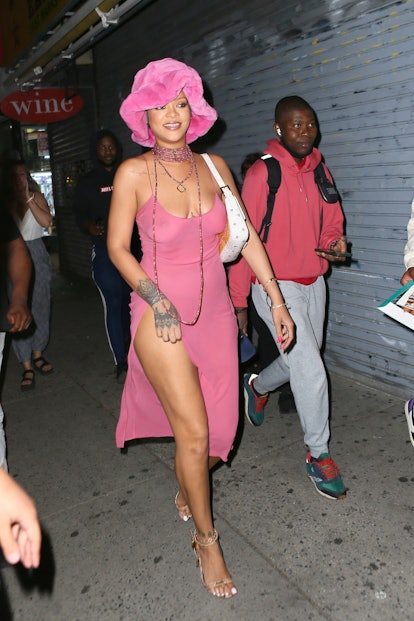 Rihanna wears a furry bucket hat and slip dress when out in New York City on June 23, 2021.