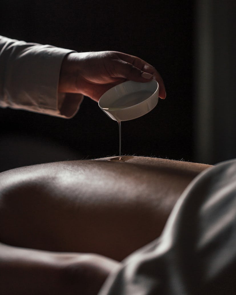 A masseuse performing the crystal-powered massage at the Four Seasons in Philadelphia