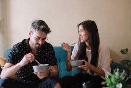 couple eating out of bowls 