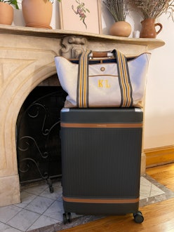 A carry-on tote bag and a check-in sized luggage 