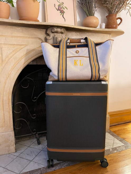 A carry-on tote bag and a check-in sized luggage 