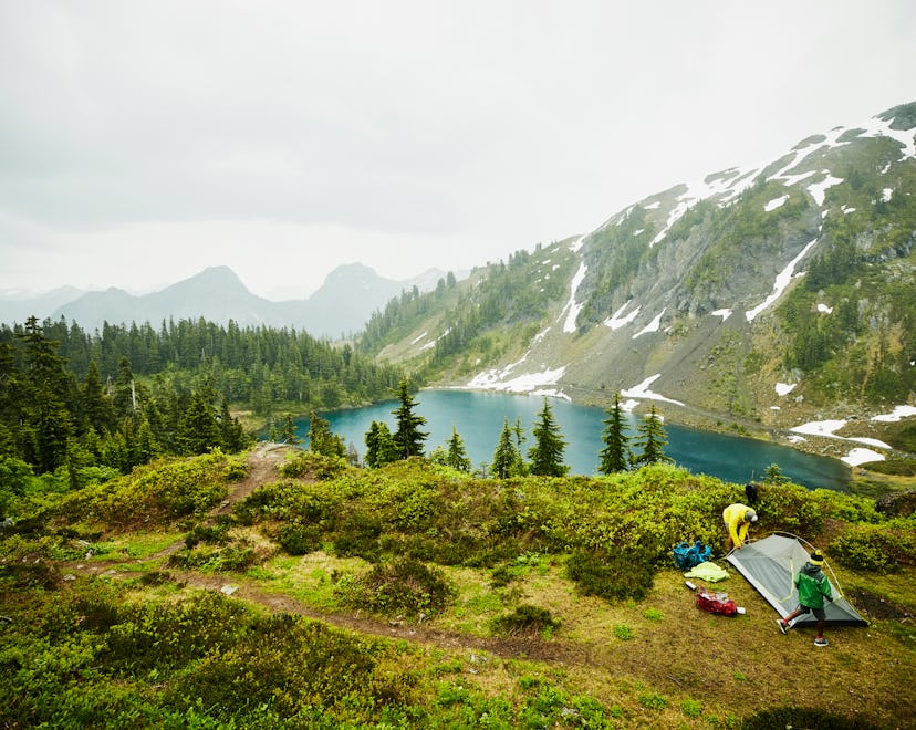 Beautiful places to go camping; small tent on campsite in mountains/forest