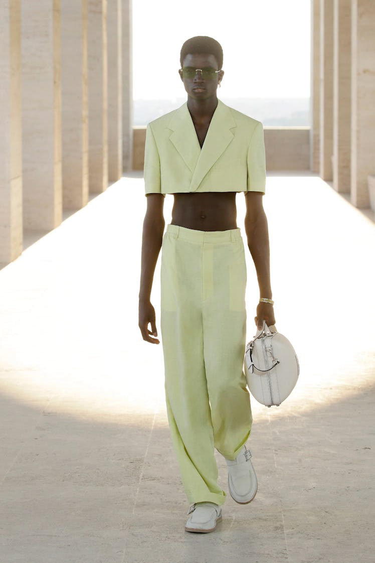 A model wearing a Fendi men's spring 2022 crop top