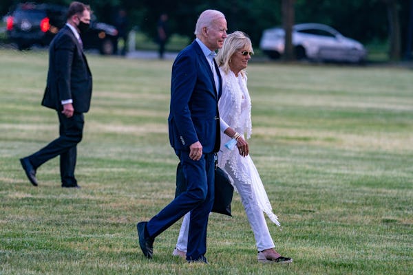 President Joe Biden and First lady Jill Biden walk on the ellipse on May 23, 2021 in Washington, DC....