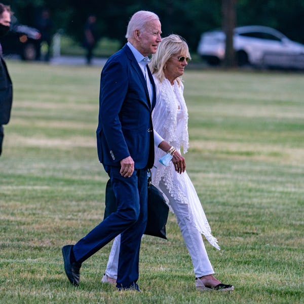 President Joe Biden and First lady Jill Biden walk on the ellipse on May 23, 2021 in Washington, DC....