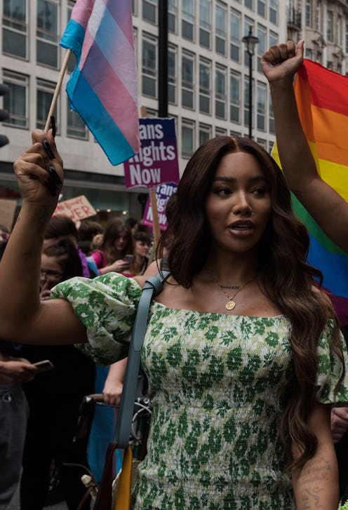 Activist and model Munroe Bergdorf waves a trans flag at london trans+ pride 2021