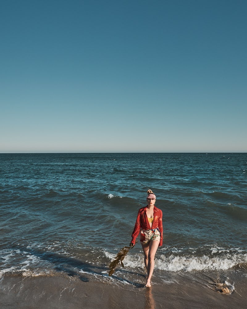 Annie Murphy, star of 'Schitt's Creek' & 'Kevin Can F*ck Himself,' stands in the water at the beach ...