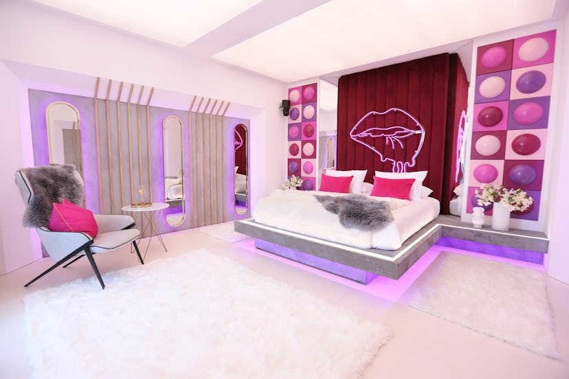 The hideaway featuring pink, red and, purple decor 
