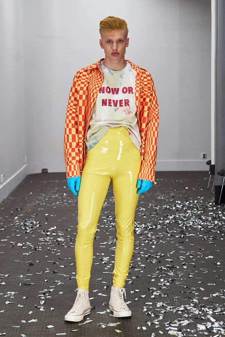 A model wearing skin-tight yellow vinyl Lazoschmidl pants