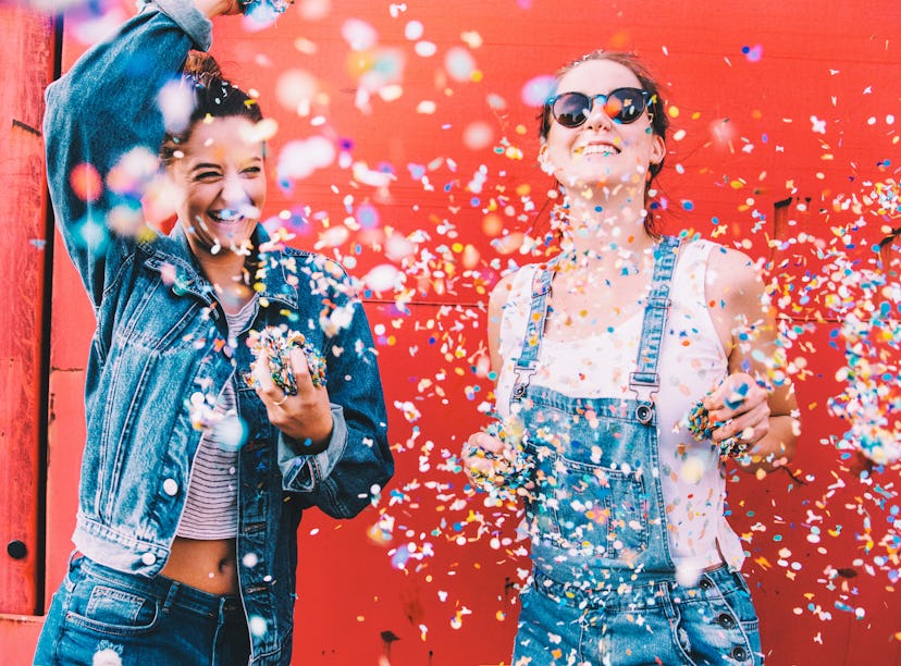 2 young women celebrating the Fourth of July, having the best July 4, 2021 per their zodiac signs.